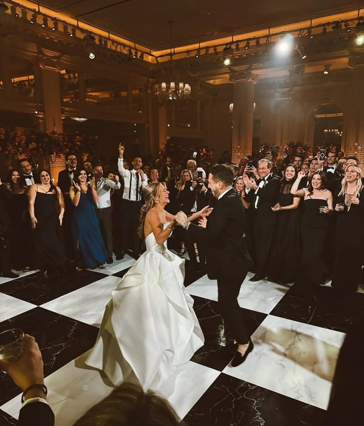 Elegant chandelier lit ballroom with a checkered dance floor set up for a Philadelphia event
