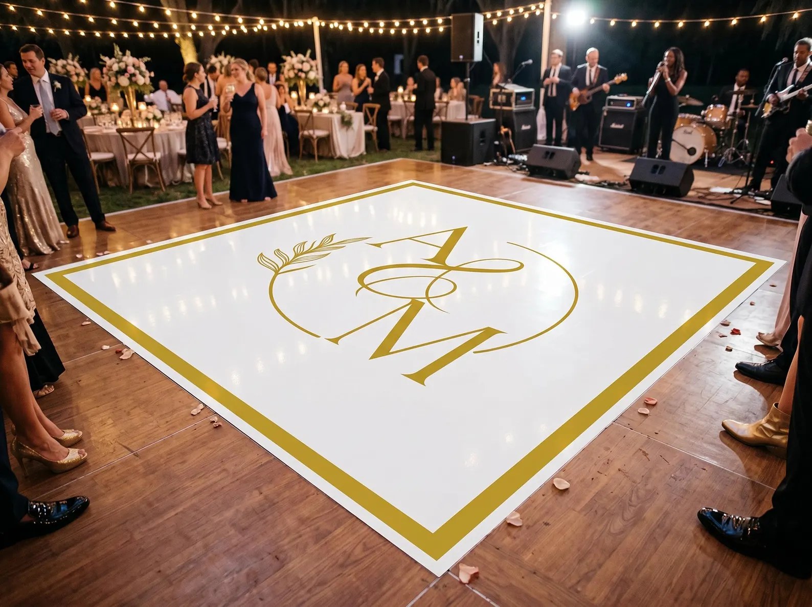Custom printed gold monogram vinyl wrap dance floor at a Philadelphia wedding