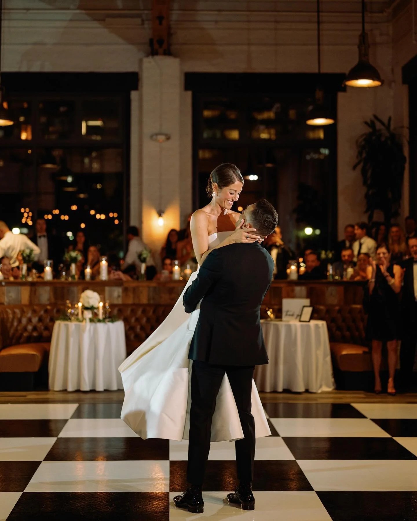 Couple sharing their first dance on a white dance floor at an outdoor Philadelphia wedding reception